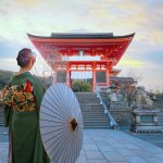Young Japanese Woman In A Traditional Kimono Dress At Kiyomizu-dera