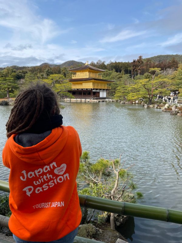 Tourist Taking A Photo Ot Kinkakuji Pavilion In Kyoto