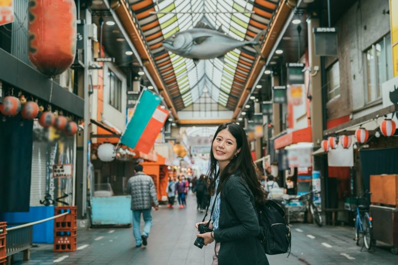 Asian Girl With Camera In Kuromon Ichiba Market Osaka