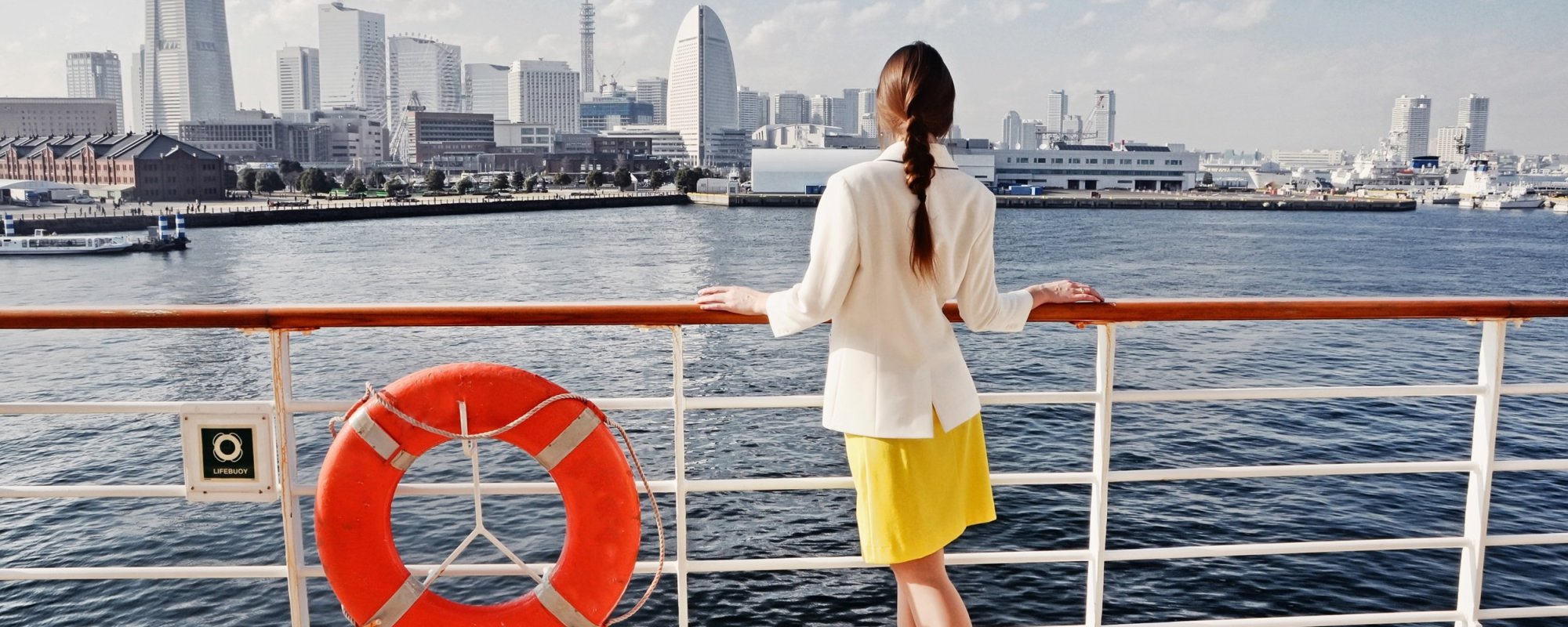 Tourist Looking At Yokohama Port From Cruise Liner