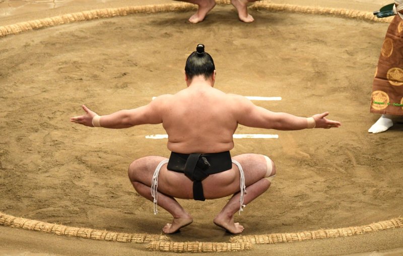 Sumo Wrestler Doing A Sumo Squat